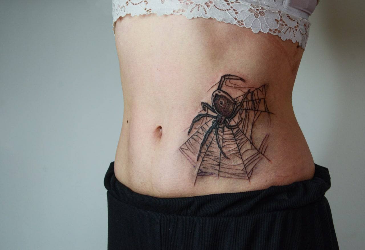 Spider web tattoo by Sa.li Tattoo